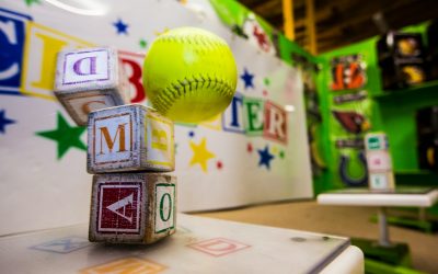 yellow and red baseball on white table